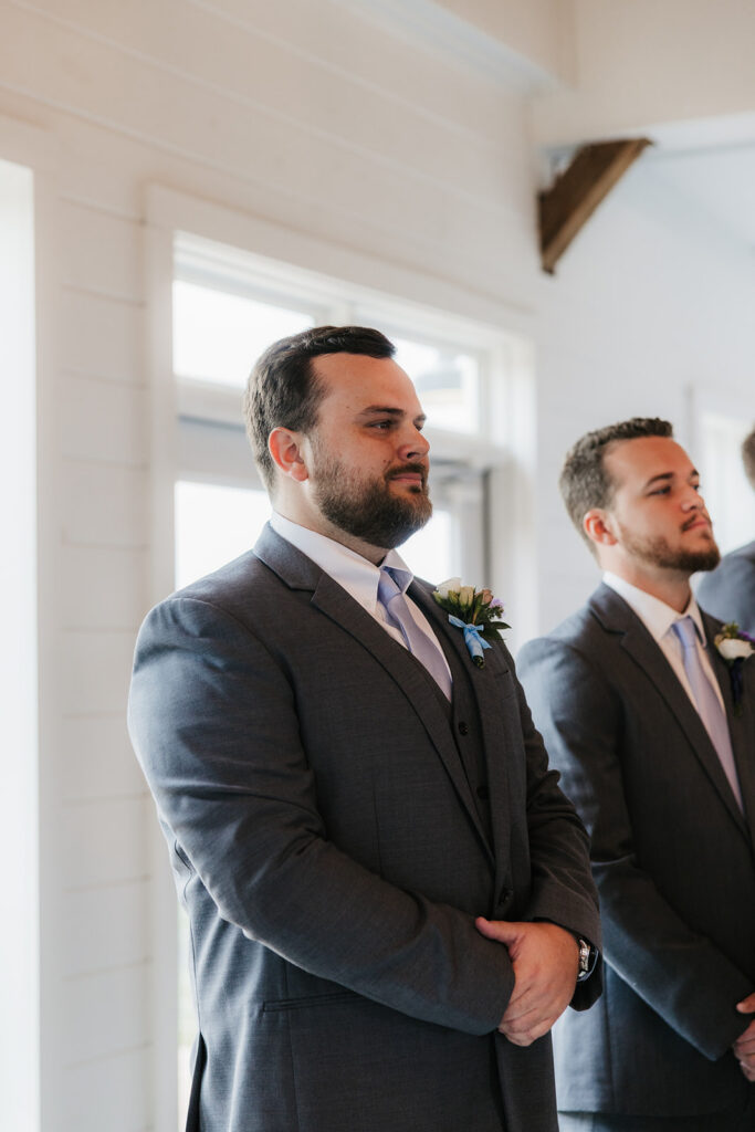 Groom emotional, watching the bride walk down the aisle