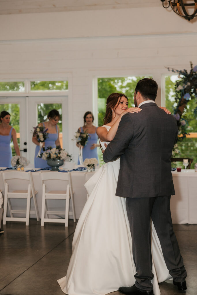 newlyweds at their first dance at their wedding reception