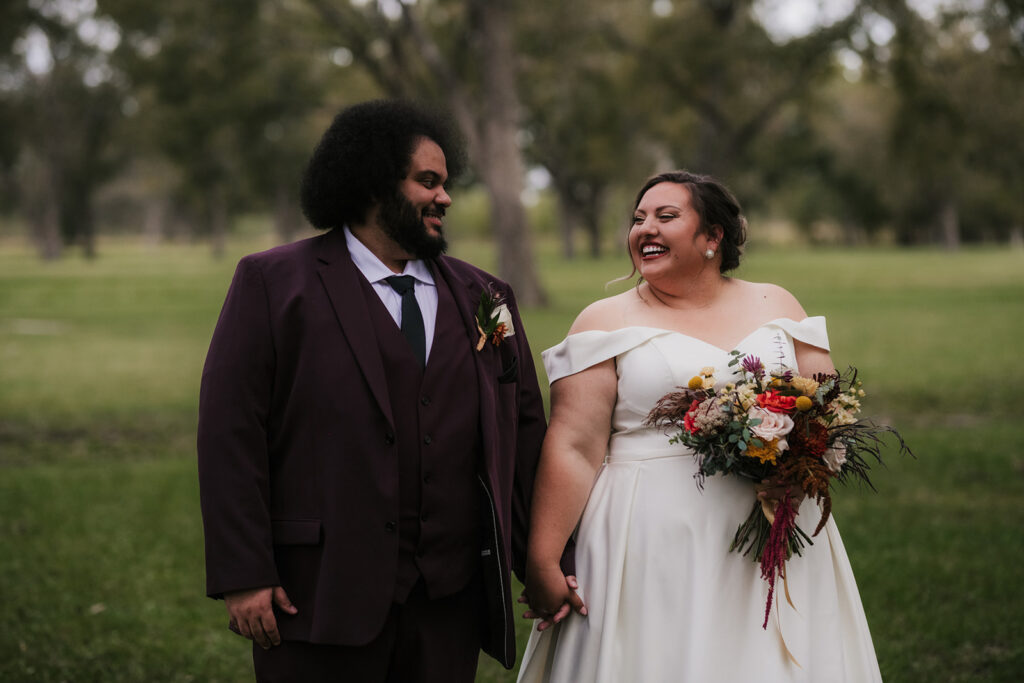 cute picture of the bride and groom holding hands