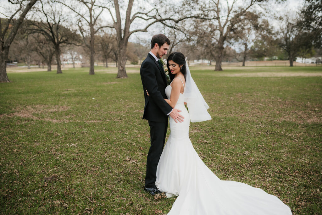 cute picture of the bride and groom hugging