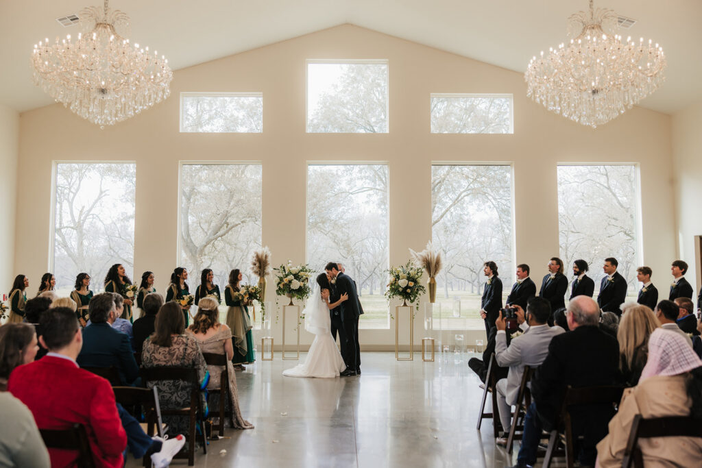 bride and groom kissing after their ceremony