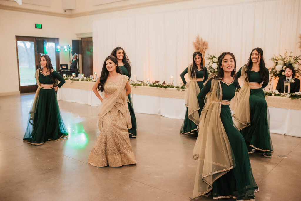 bride and wedding guests dancing at the wedding reception