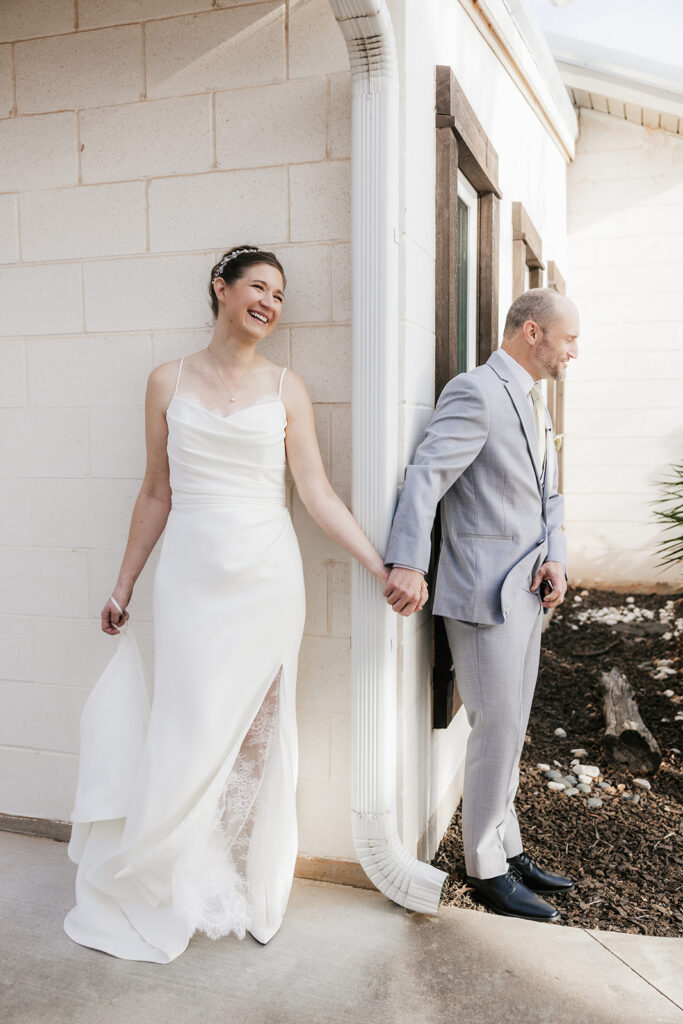 bride and groom at their first touch before the ceremony