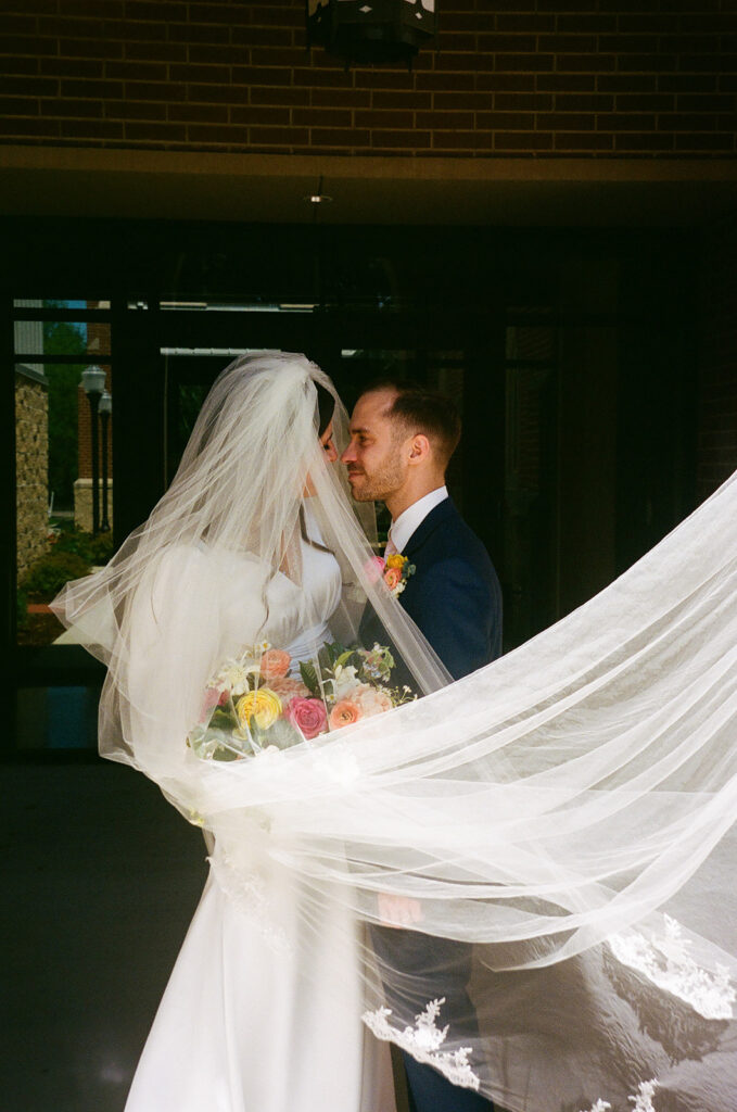 picture of the newly married couple kissing