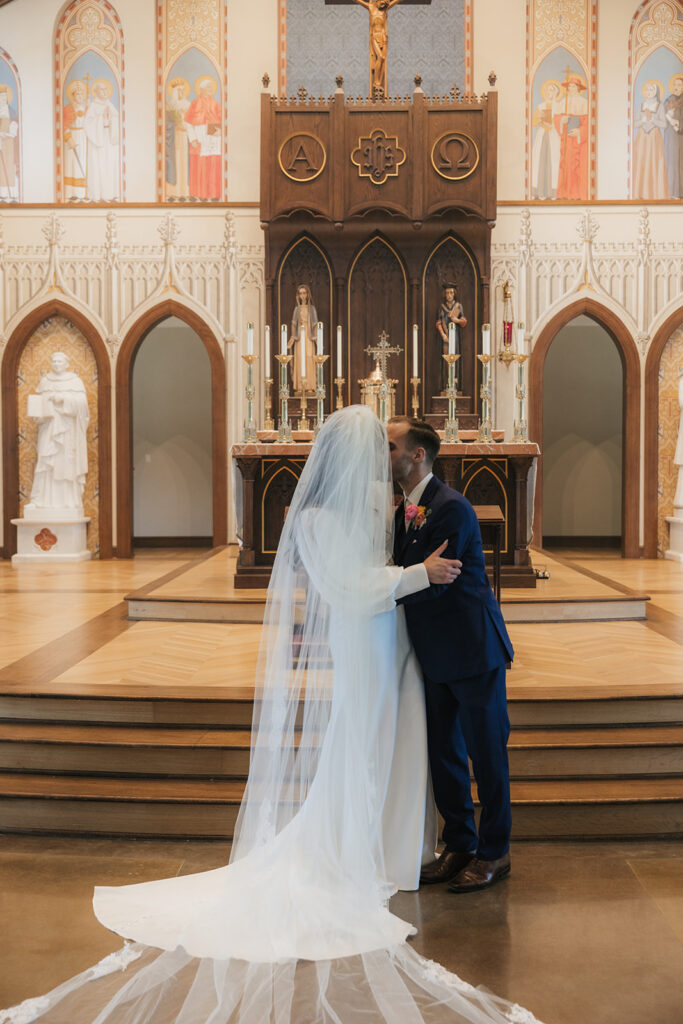 portrait of the newlyweds kissing