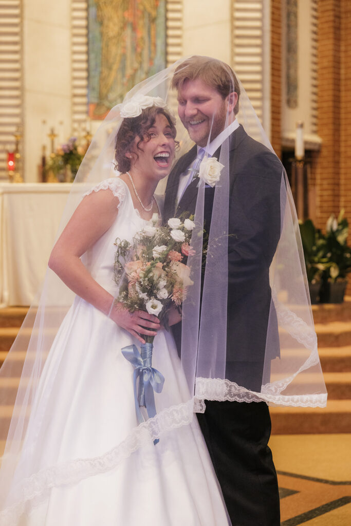 cute picture of the newlyweds laughing with each other