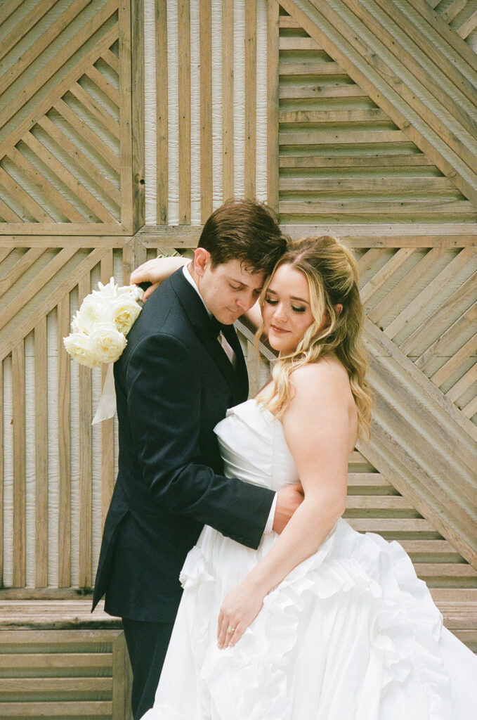groom kissing the bride on the forehead