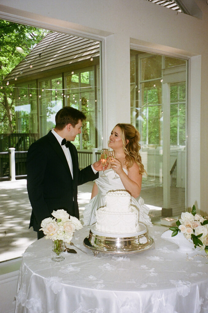newlyweds trying their wedding cake