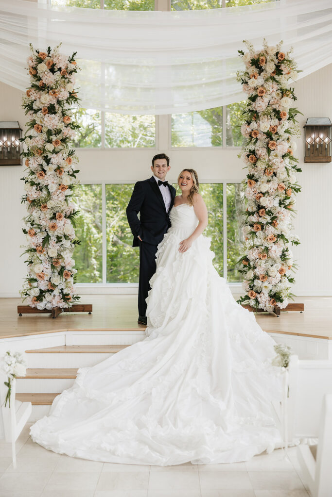bride and groom smiling at each other during their photoshoot