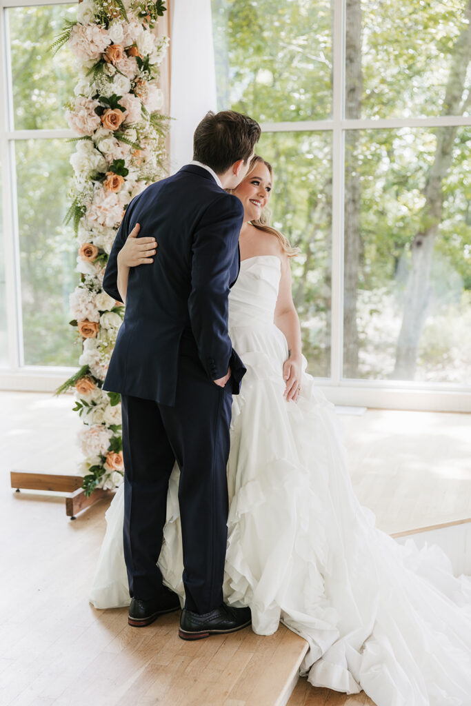 groom kissing the bride on the cheek