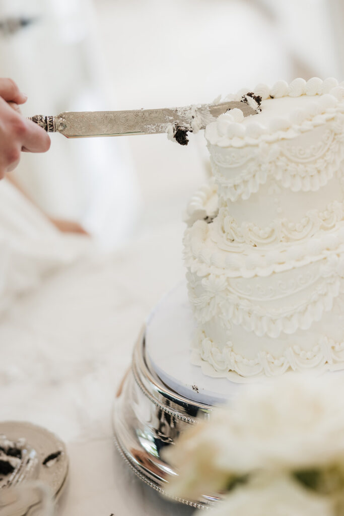 newlyweds cutting their wedding cake