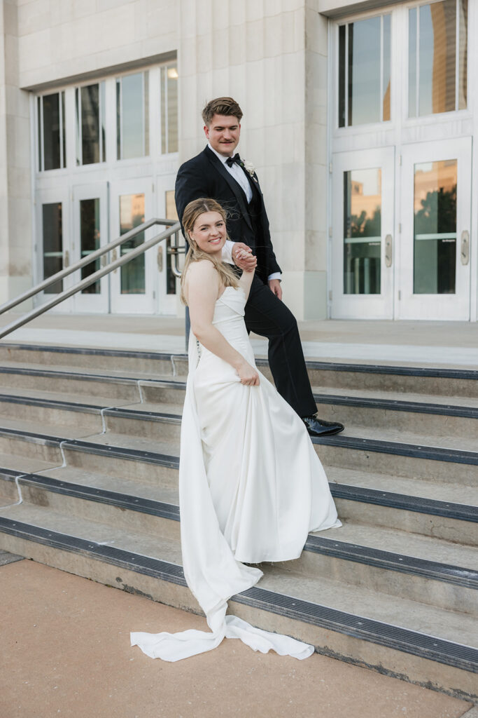 newlyweds holding hands during their romantic bridal session