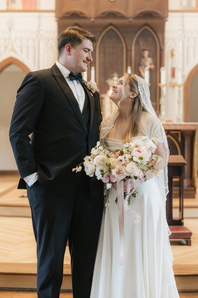 cute picture of the bride and groom smiling at each other