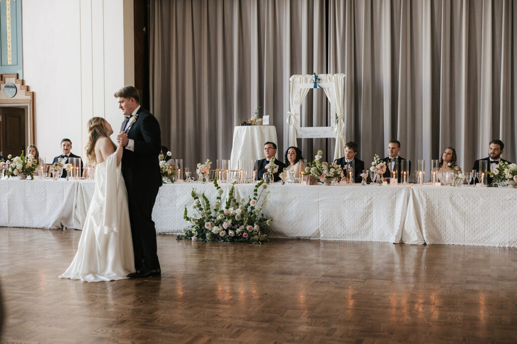 newlyweds at their first dance at their wedding reception