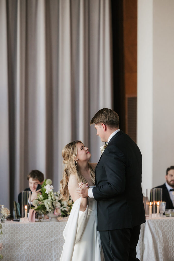cute picture of the newlyweds smiling at each other