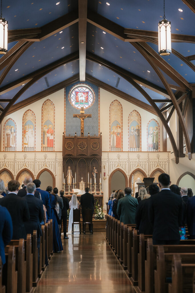 bride and groom holding hands during their wedding ceremony