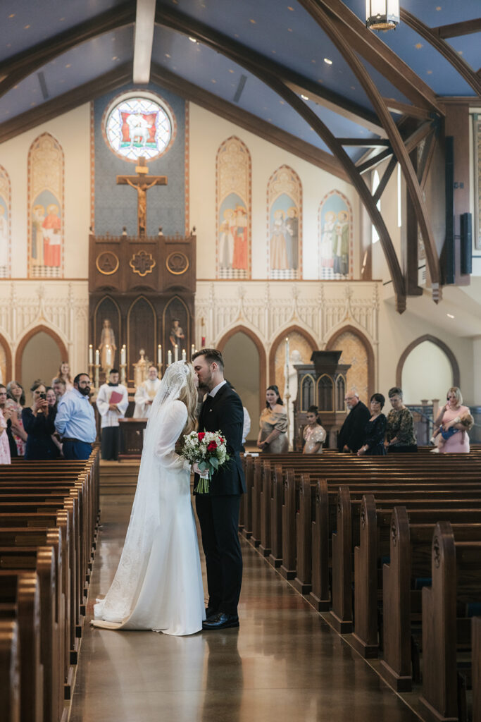 cute picture of the newlyweds kissing