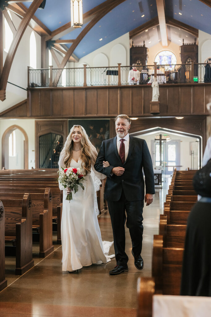 beautiful picture of the bride walking down the aisle