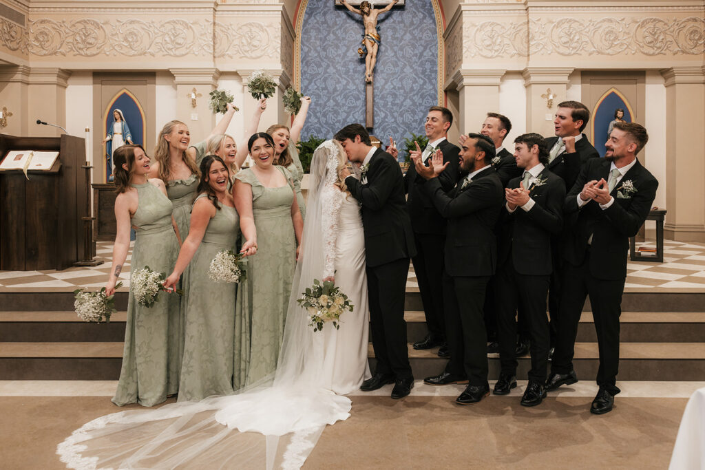 stunning portrait of the bride and groom with their bridal parties