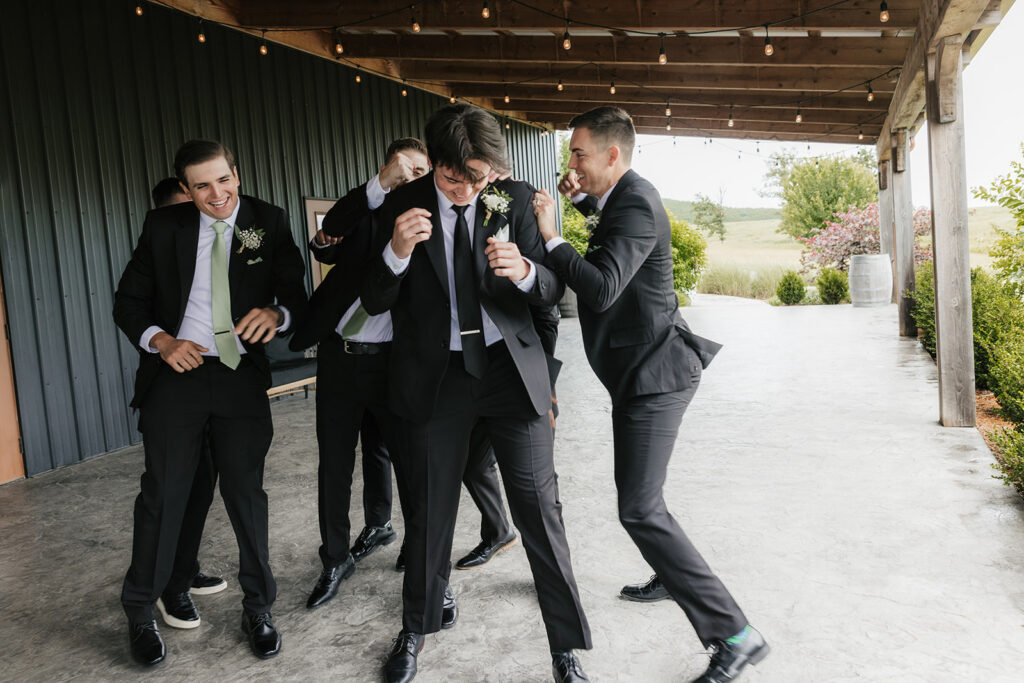 playful portrait of the groom and his groomsmen
