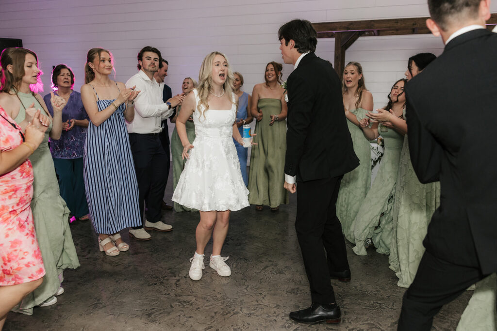 fun picture of the newlyweds dancing at their dream wedding reception party