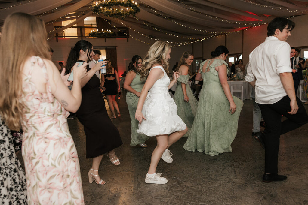 bride having the best time at the wedding reception party