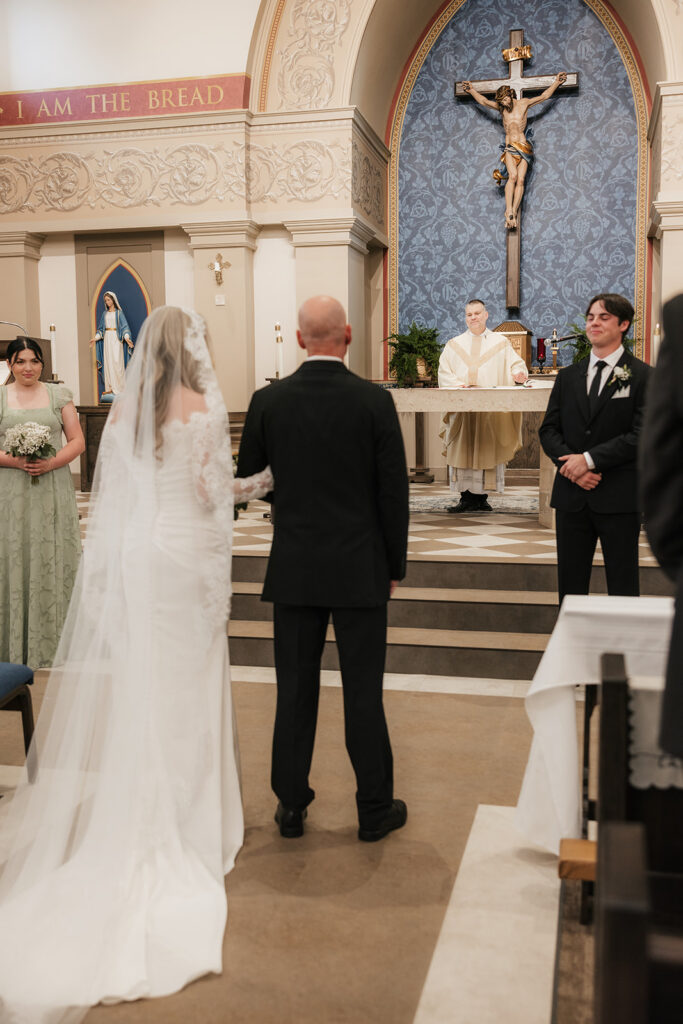 beautiful picture of the bride walking down the aisle
