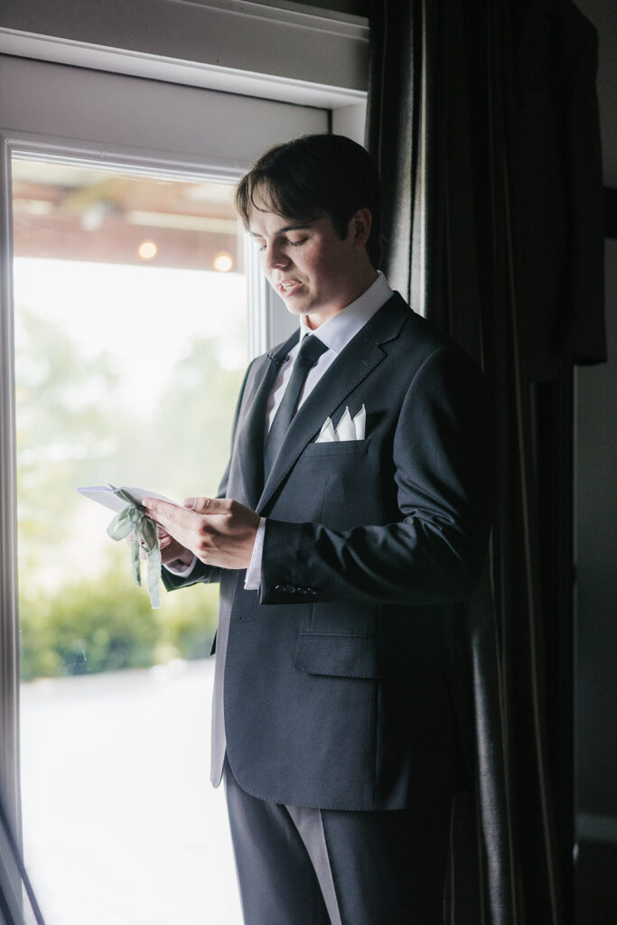 groom emotional reading his wedding vows