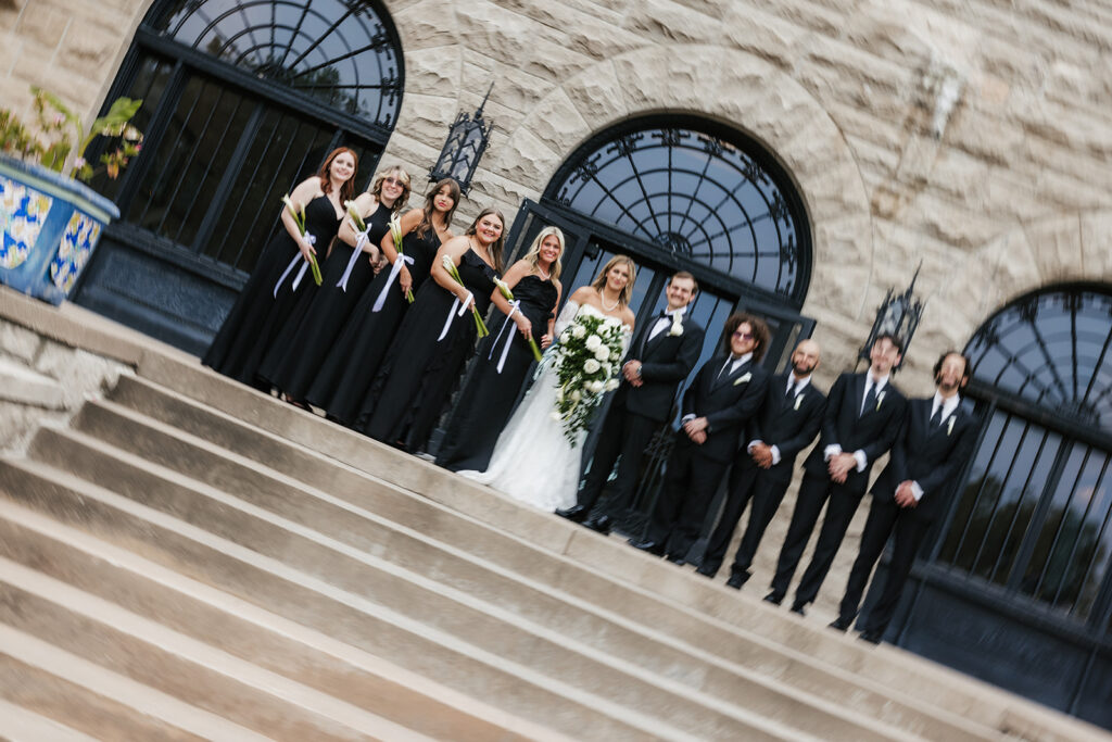 cute picture of the bride and groom with their bridal parties