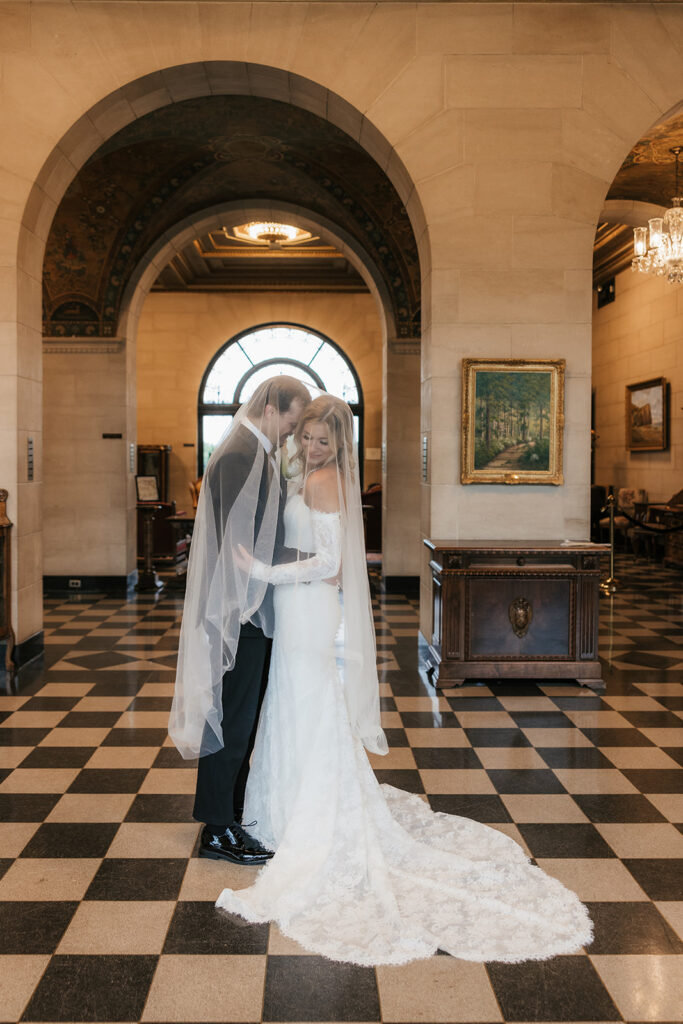 groom kissing the bride on the cheek