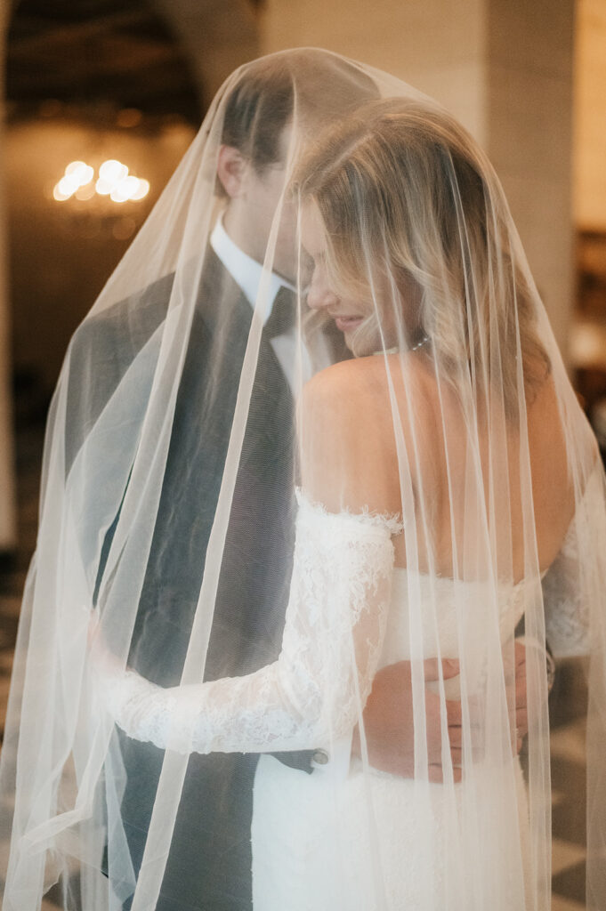 groom kissing the bride on the forehead
