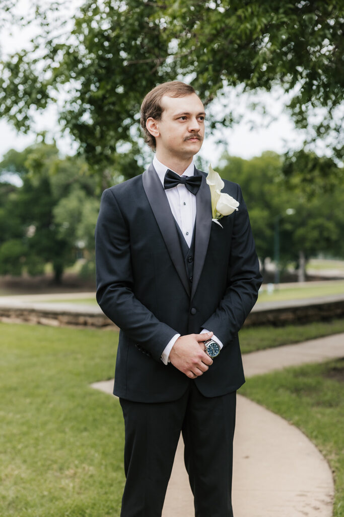 groom emotional watching the bride walking down the aisle