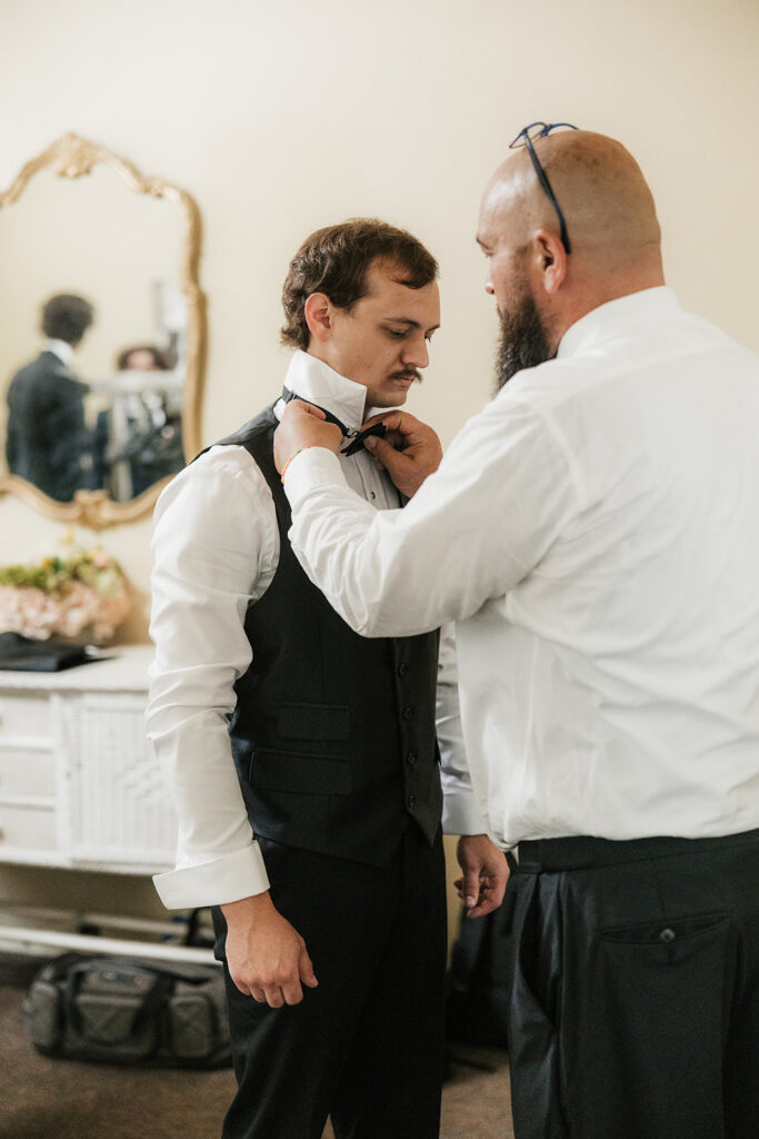 picture of the groom getting ready for the ceremony