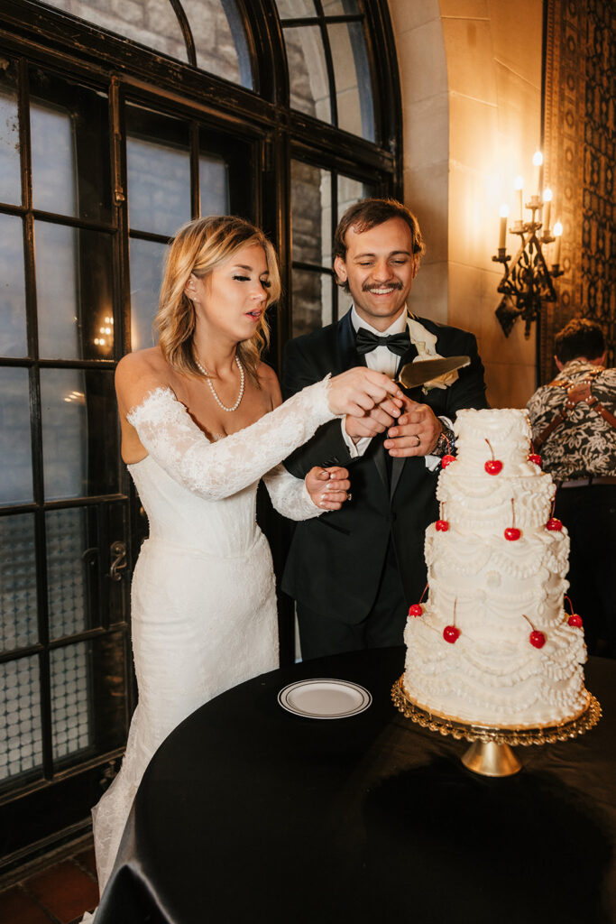newlyweds cutting their wedding cake