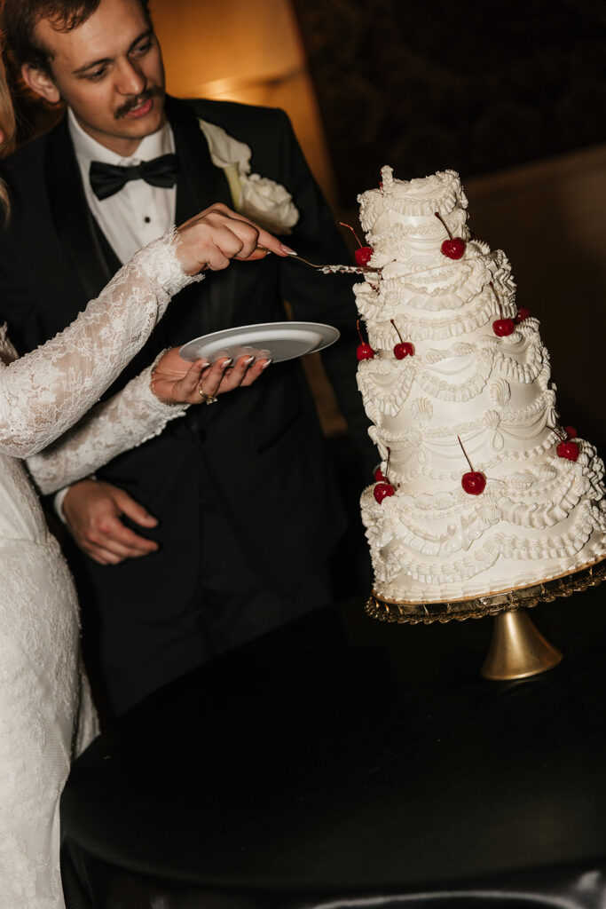 newlyweds trying their wedding cake