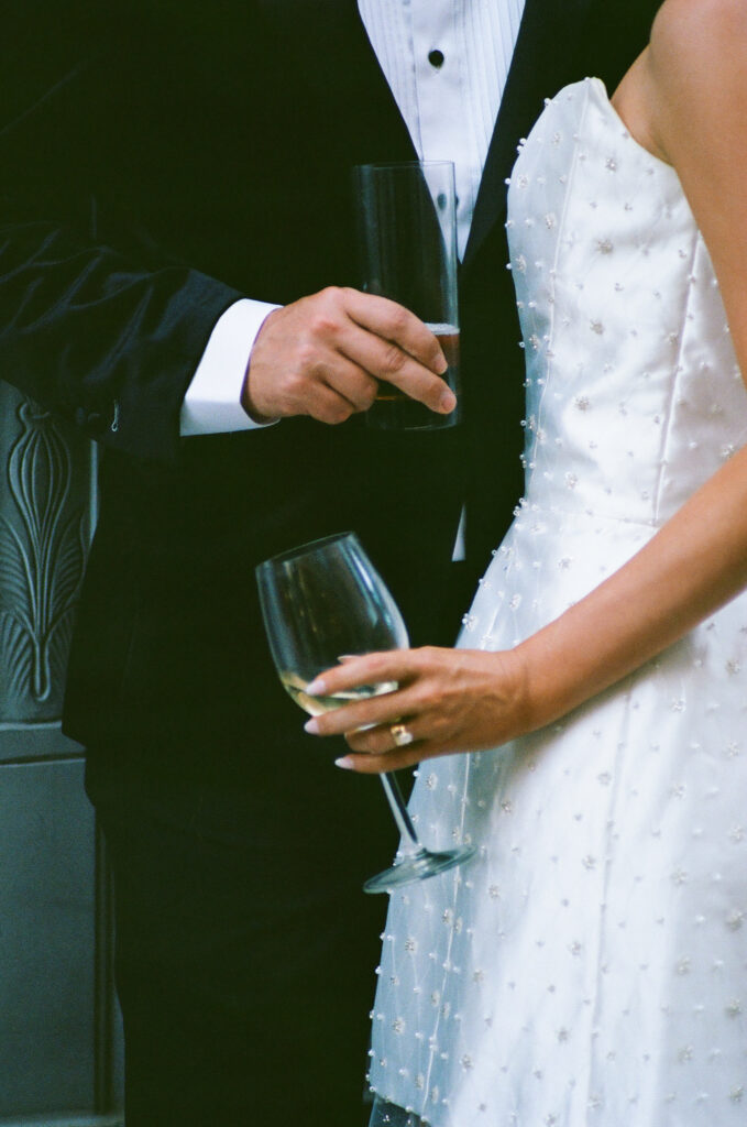 bride and groom celebrating with champagne