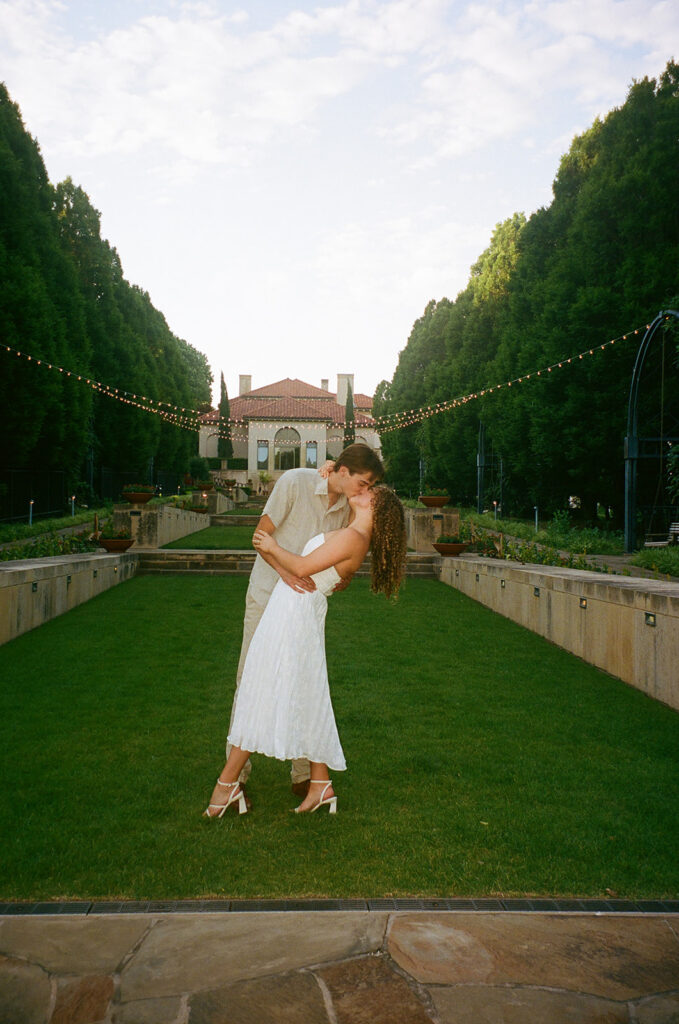 beautiful picture of the newly engaged couple kissing
