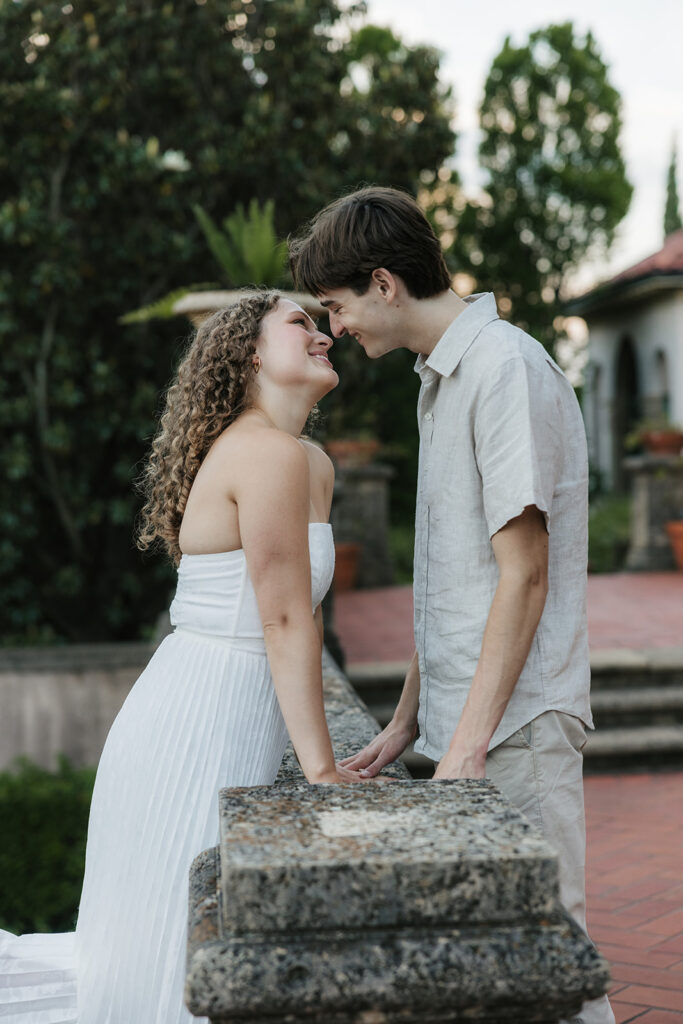 cute picture of the newly engaged couple smiling at each other