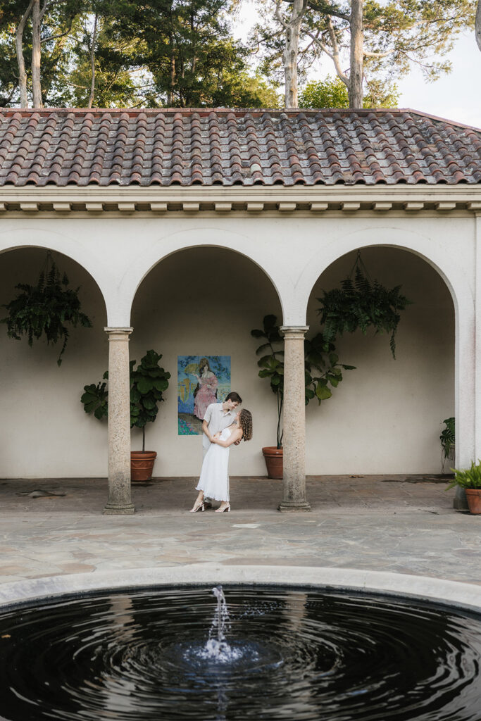 beautiful picture of the newly engaged couple kissing