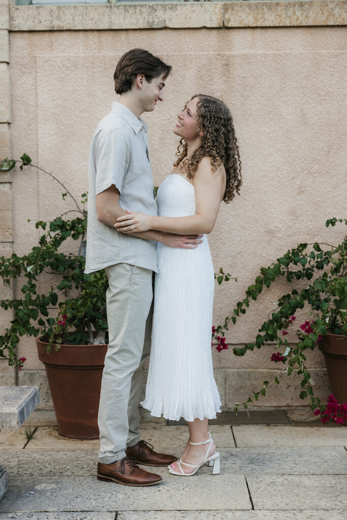 couple smiling at each other during their photoshoot