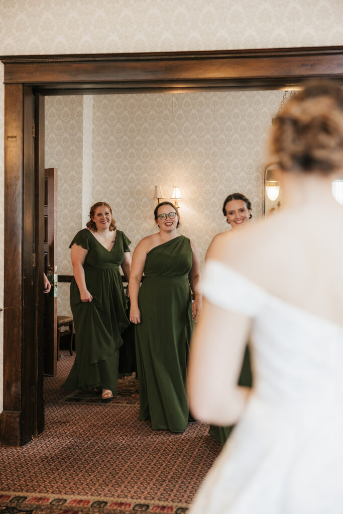 cute first look of the bride with her bridesmaids