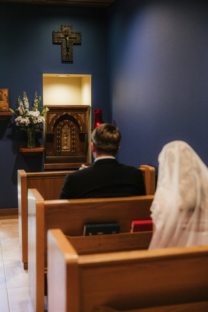 bride and groom praying before their ceremony