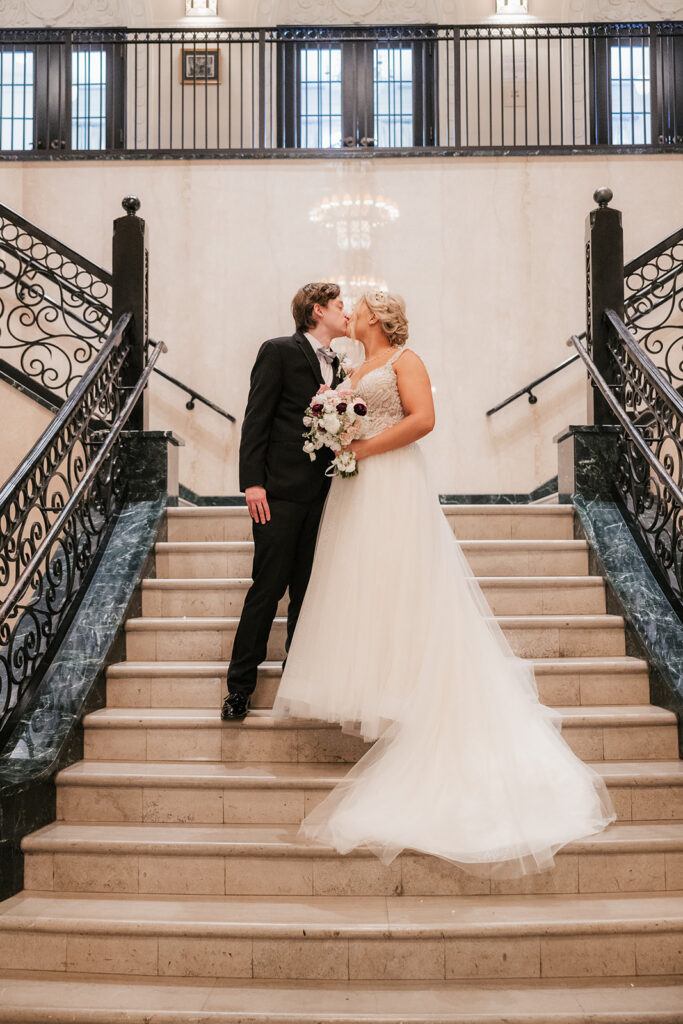 cute picture of the bride and groom kissing