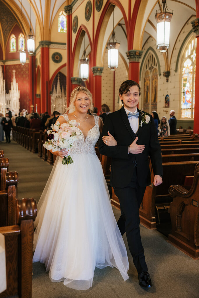 cute picture of the newlyweds heading to their wedding reception
