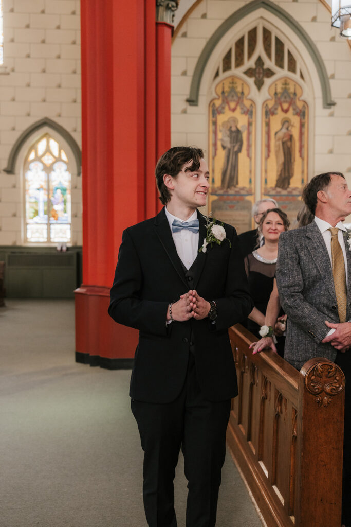 groom emotional watching the bride