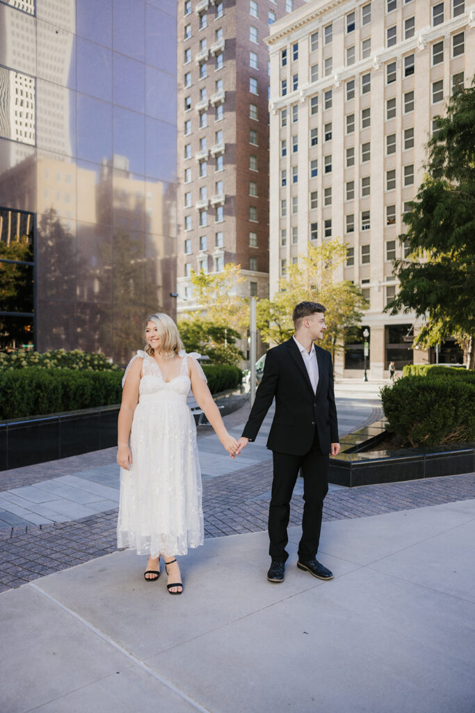 cute picture of the newly engaged couple holding hands