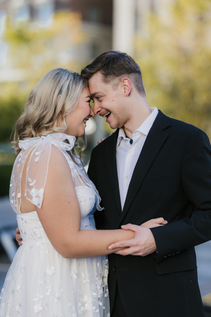 cute picture of the newly engaged couple smiling at each other