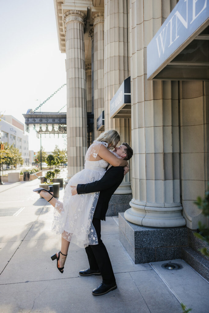 cute portrait of the newly engaged couple kissing