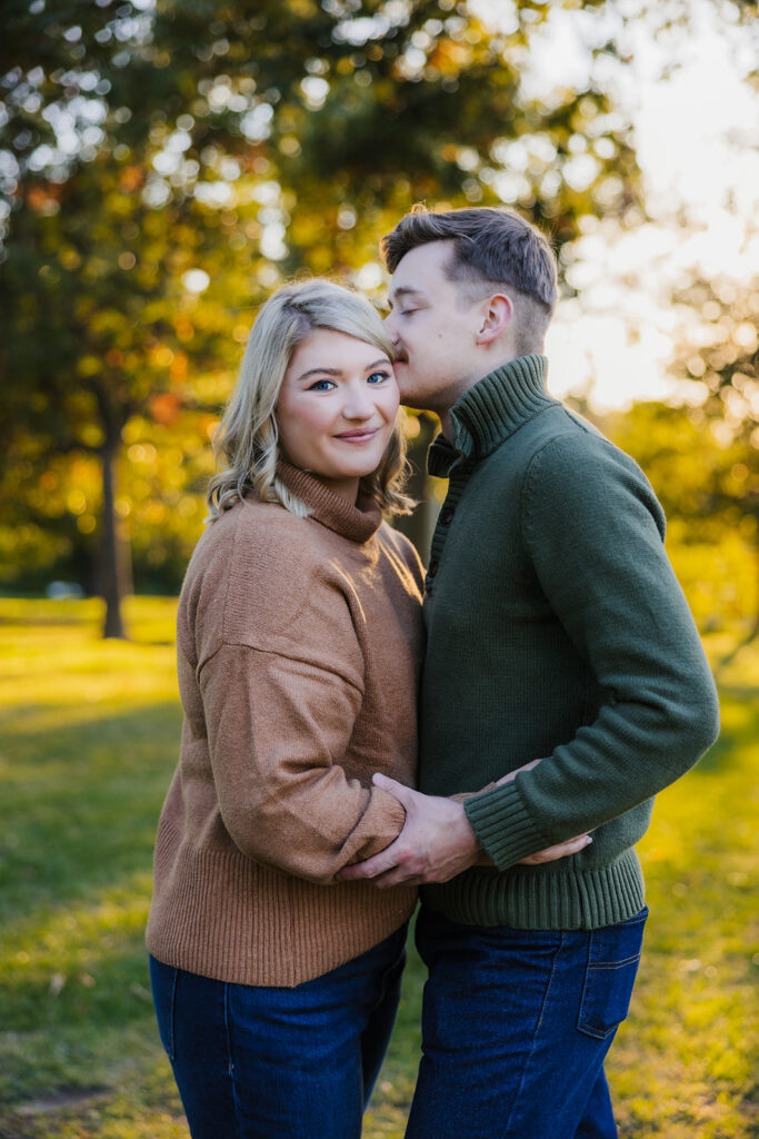 fiance kissing his fiance on the cheek
