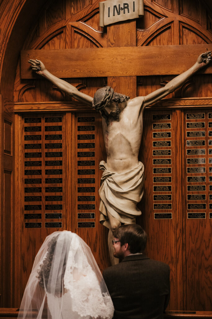 bride and groom praying before the ceremony
